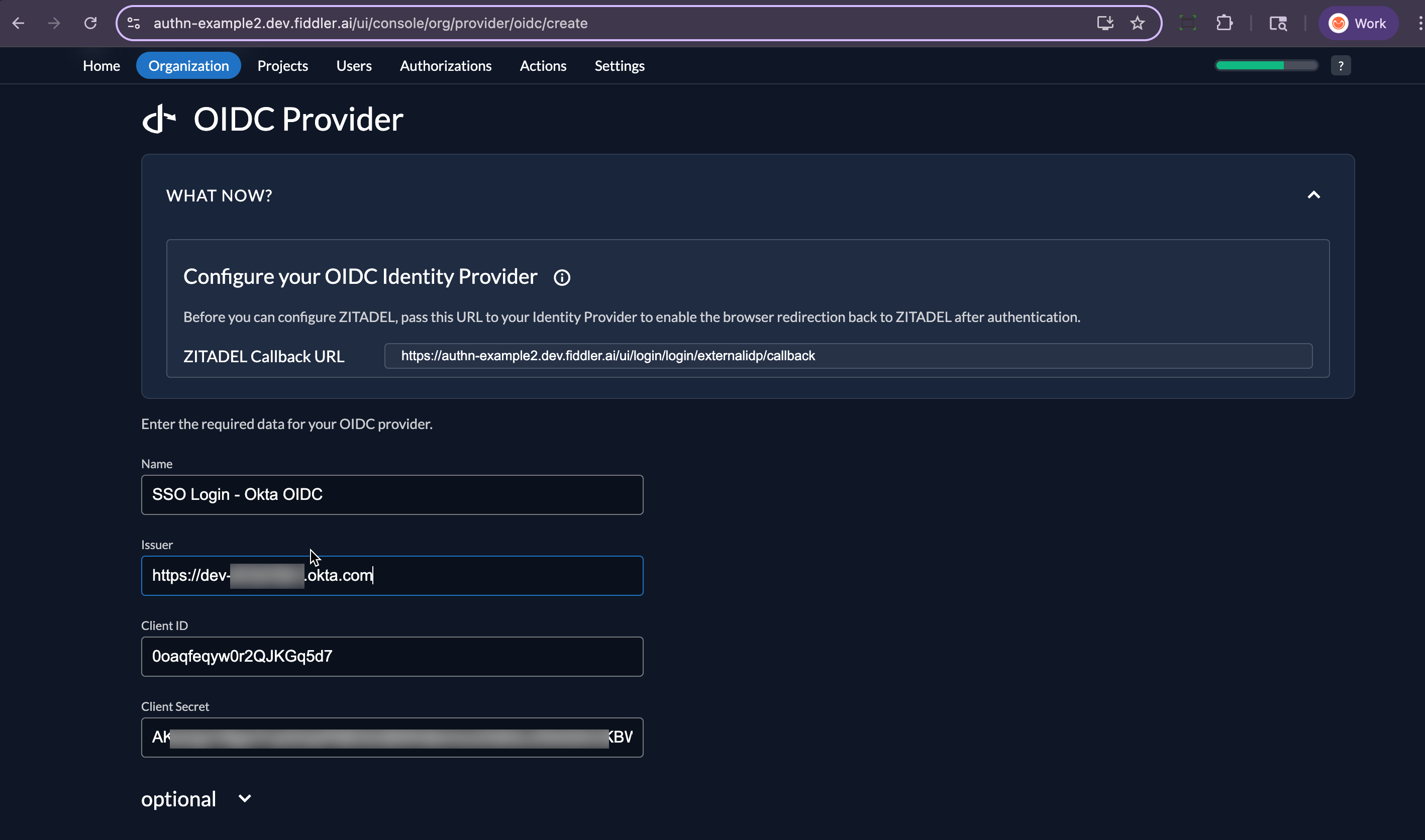 Okta admin console application page with client id and secret